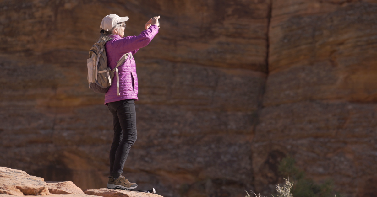 Woman outside taking photo while wearing Women's Balance Shoe Hiker - Brown Woman outside taking photo while wearing Women's Balance Shoe Hiker - Brown