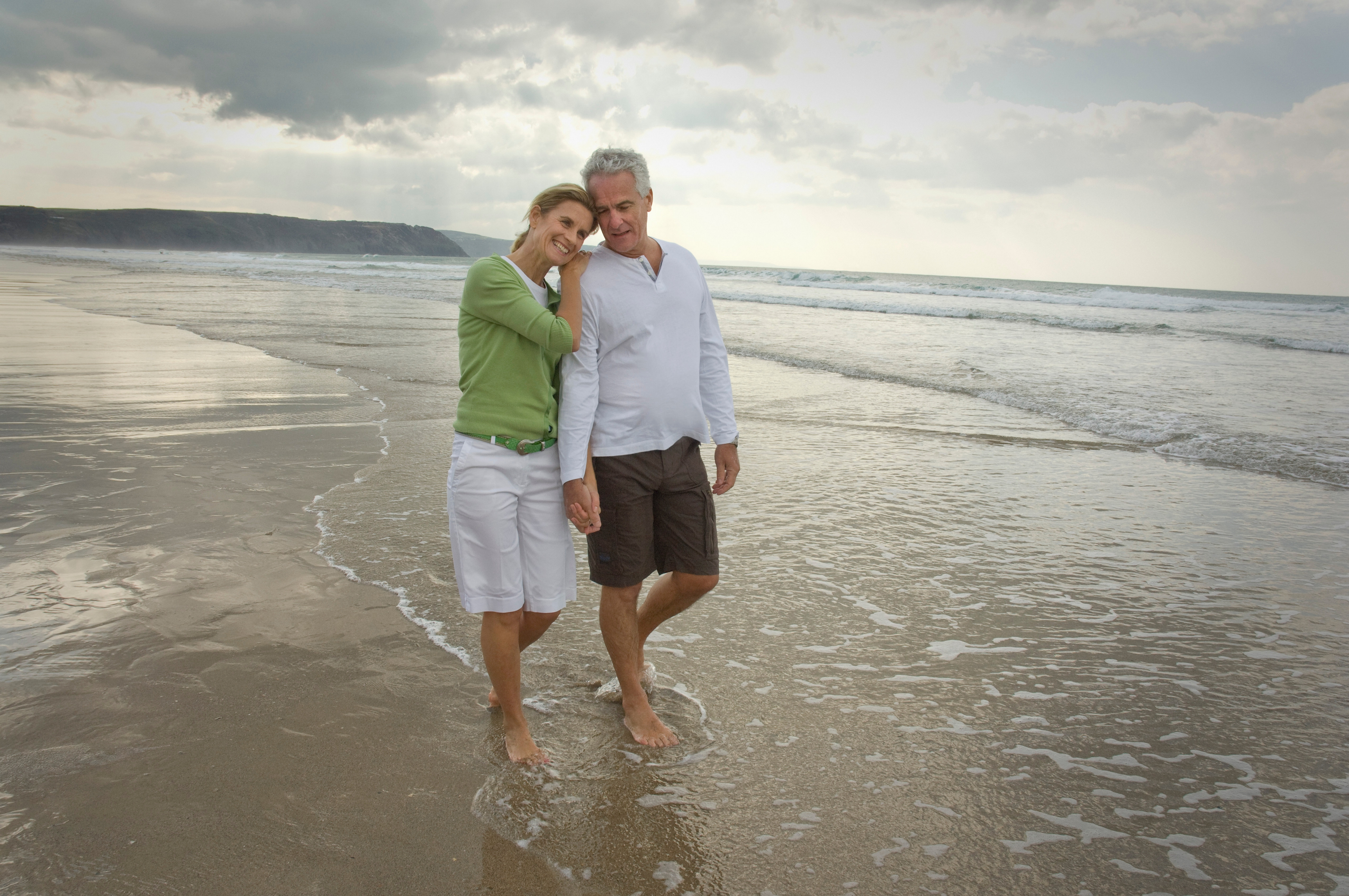 Couple walking on beach Couple walking on beach