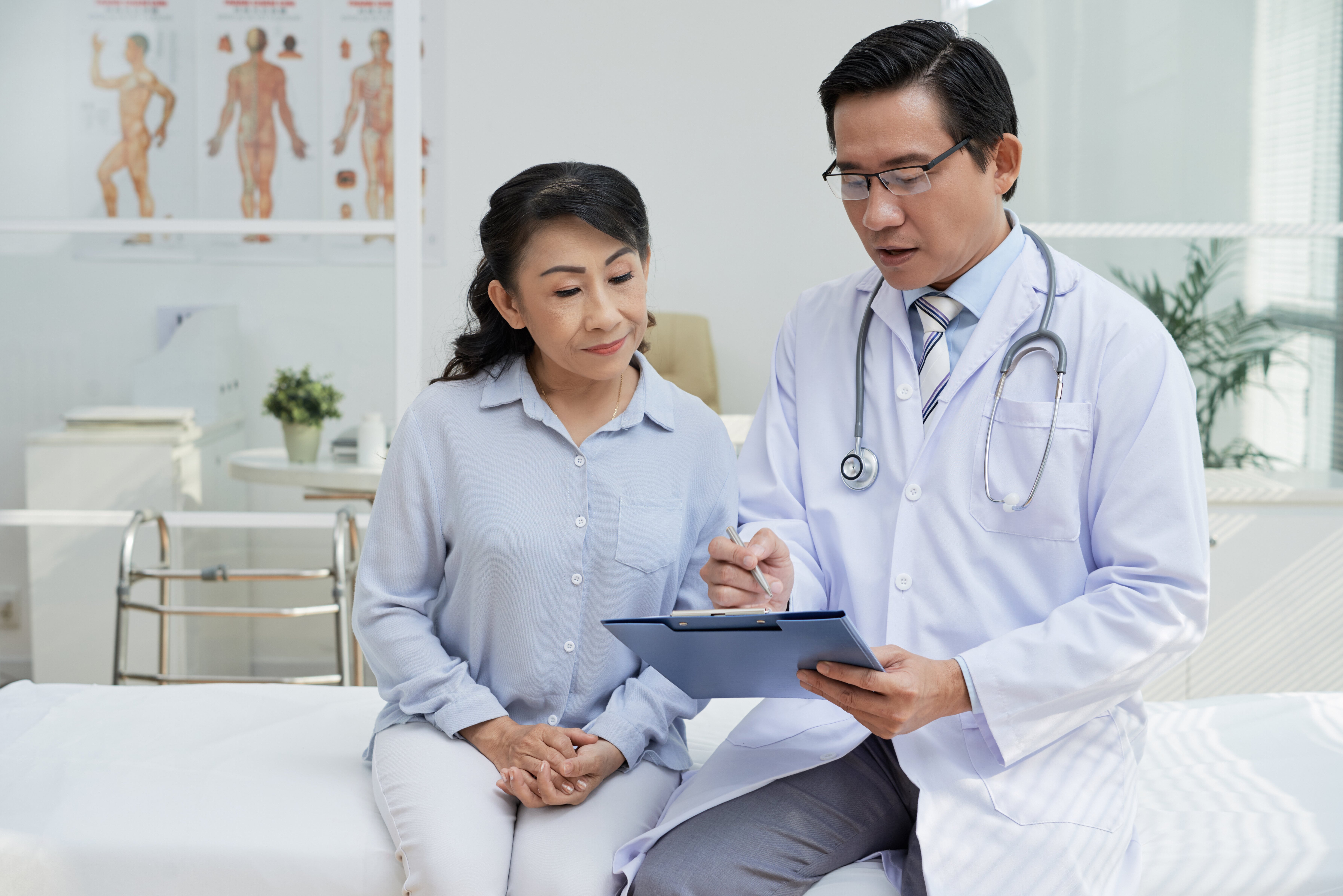 Doctor talking to patient in doctor's office Doctor talking to patient in doctor's office