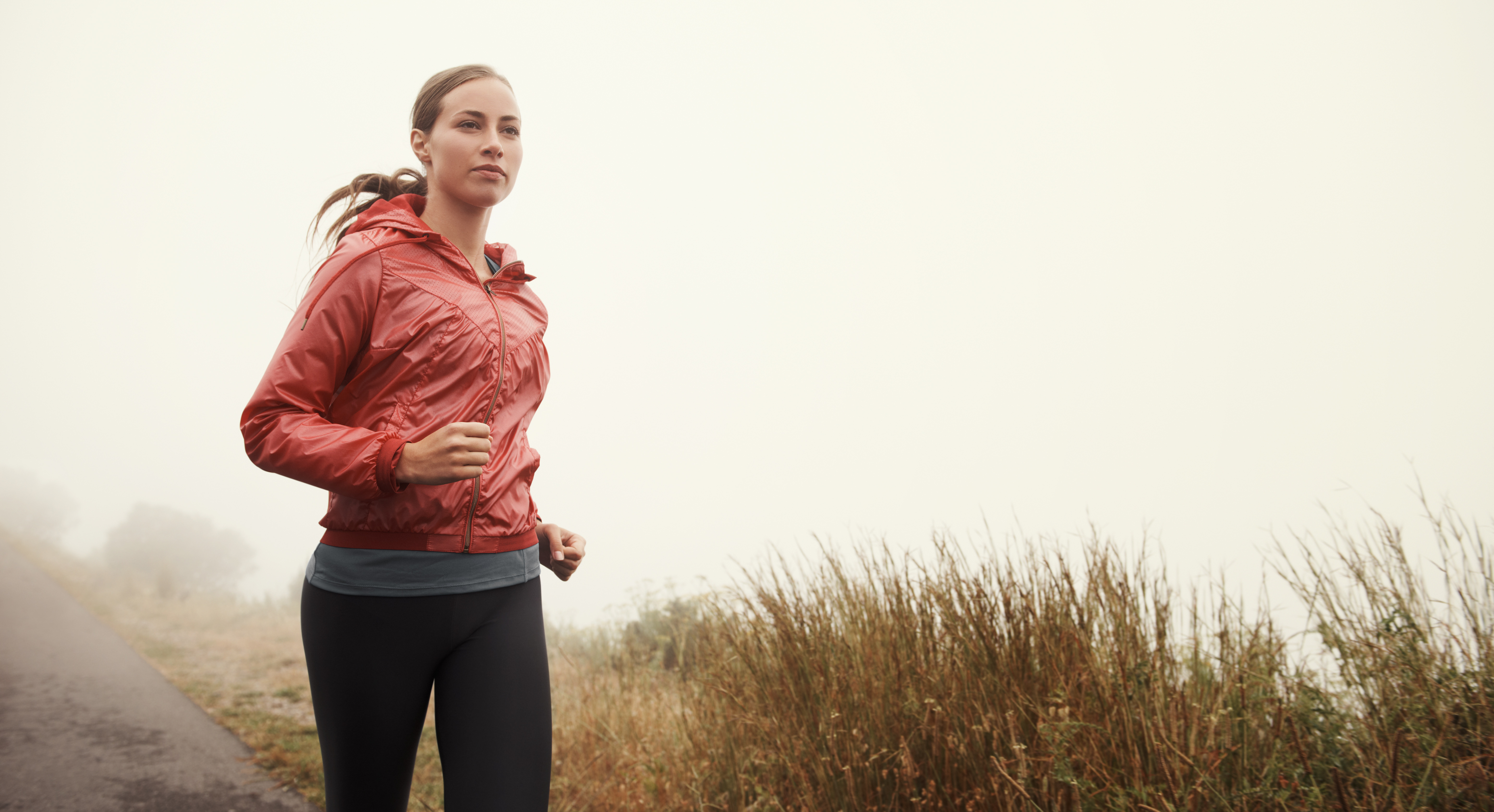 Woman running on trail Woman running on trail