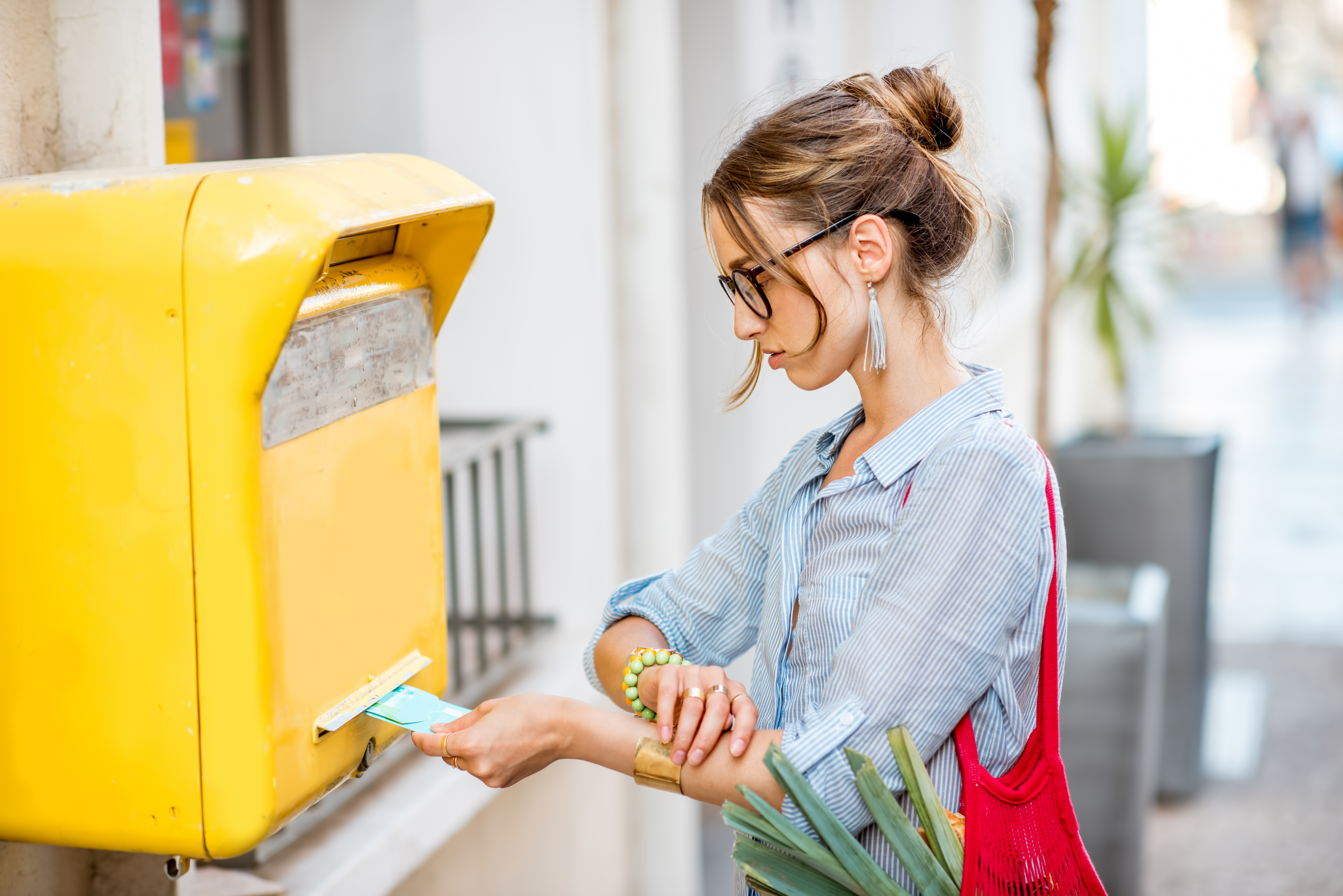 Woman collecting mail from mailbox Woman collecting mail from mailbox