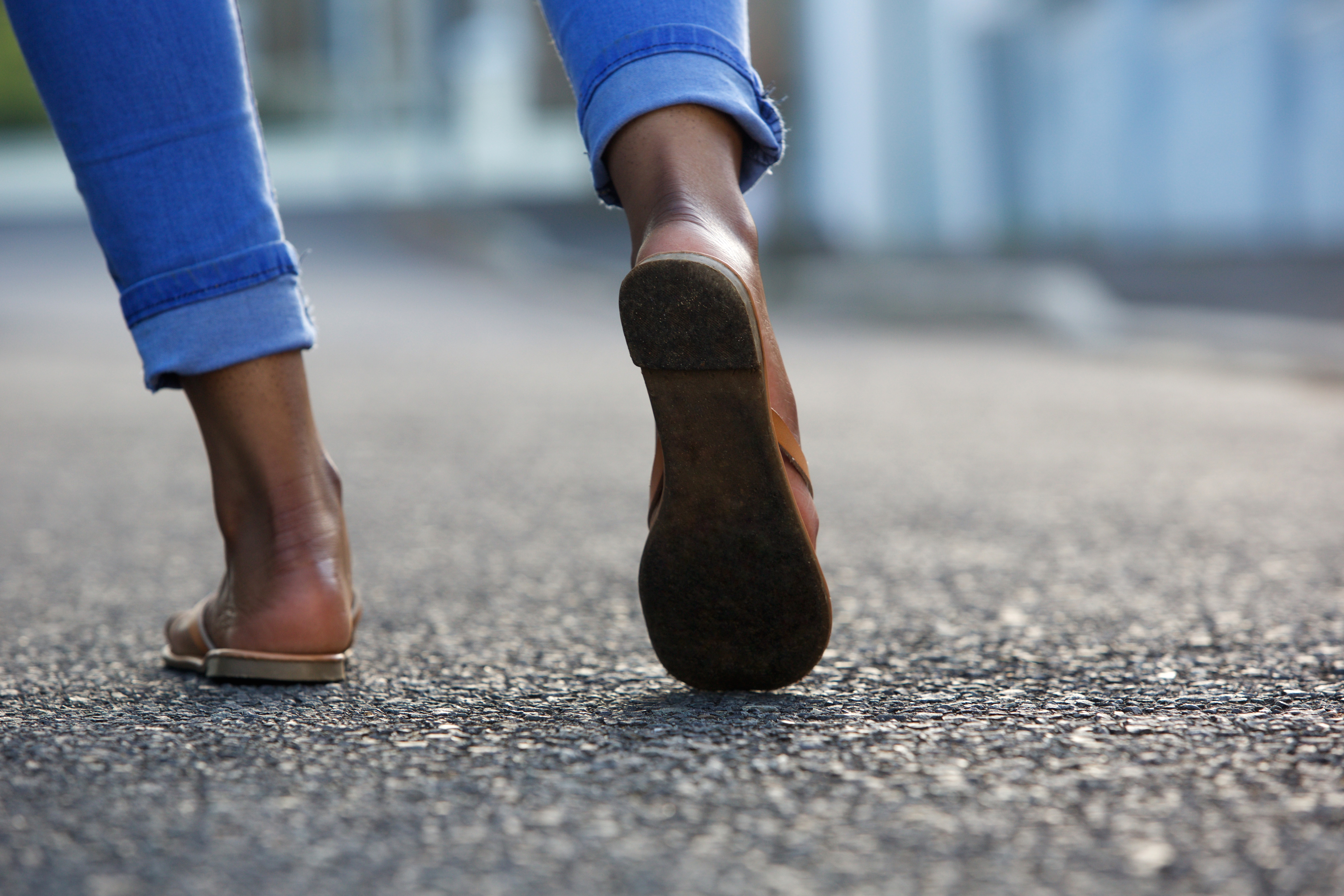 Close up of woman wearing sandals Close up of woman wearing sandals