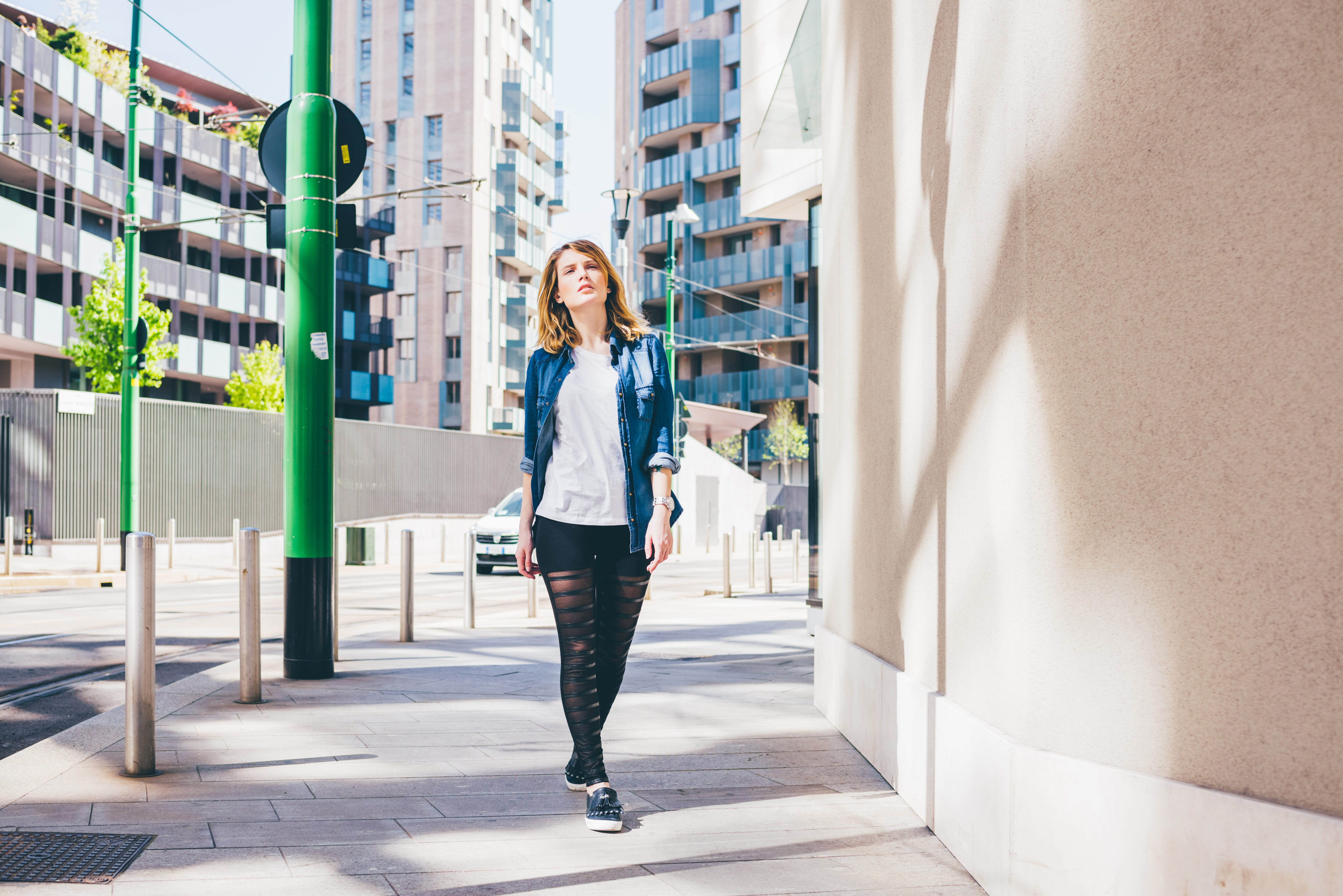 Woman walking down street Woman walking down street